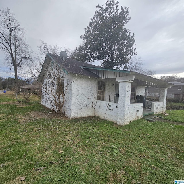 view of property exterior featuring a yard