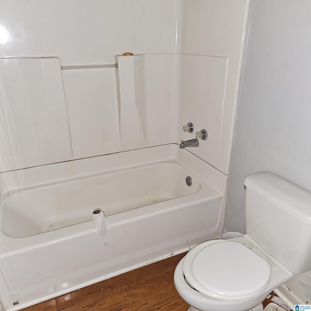 bathroom with toilet and wood-type flooring