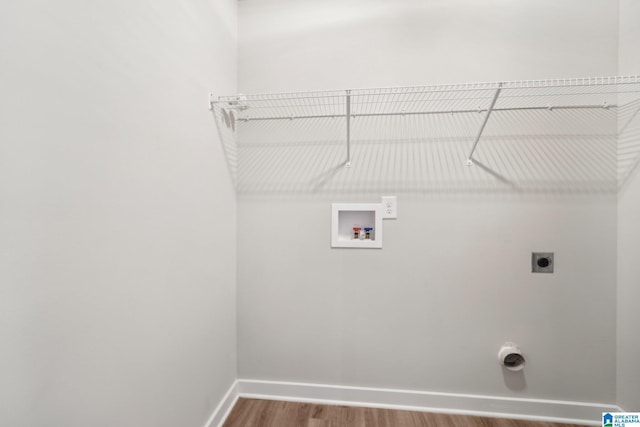 laundry room featuring hookup for an electric dryer, hardwood / wood-style floors, and washer hookup