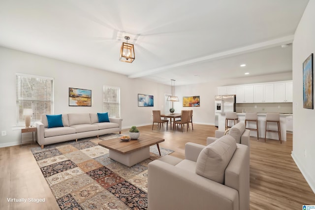 living room with light hardwood / wood-style flooring