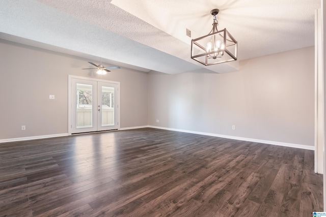 interior space with french doors, dark wood-type flooring, and a textured ceiling