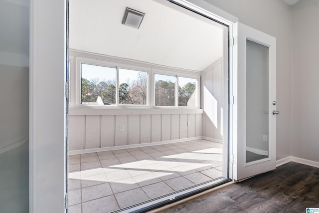 unfurnished sunroom featuring a wealth of natural light