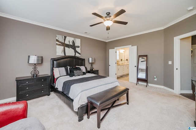 bedroom featuring ceiling fan, ornamental molding, carpet floors, and ensuite bath