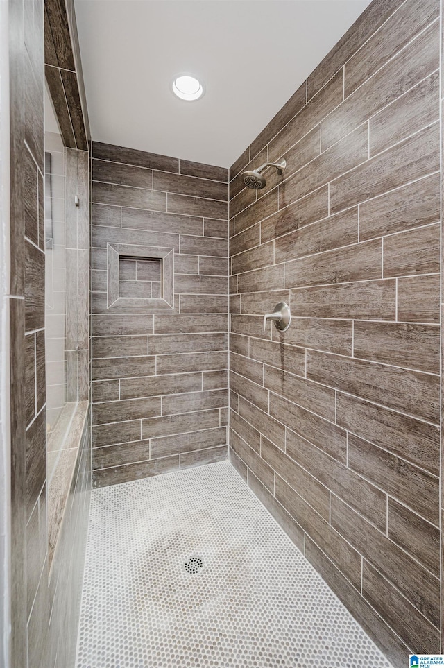 bathroom with tiled shower