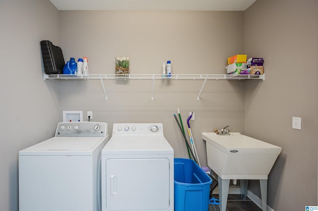 laundry area featuring separate washer and dryer and sink