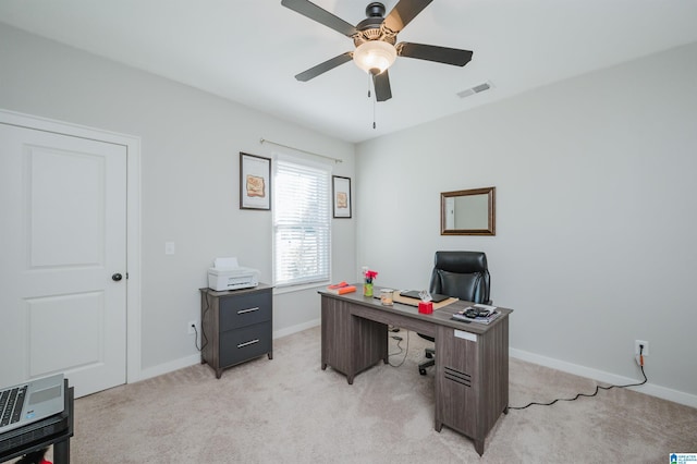 carpeted home office with heating unit and ceiling fan