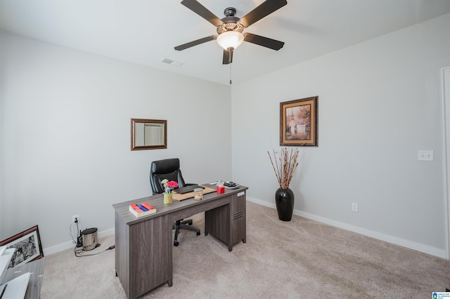 office space with ceiling fan and light colored carpet