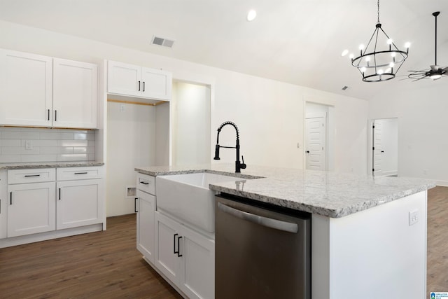 kitchen featuring white cabinetry, decorative light fixtures, stainless steel dishwasher, and an island with sink