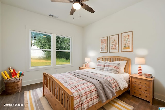 bedroom with dark wood-type flooring and ceiling fan