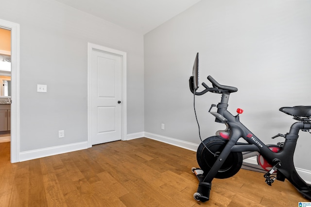 workout area with light wood-type flooring