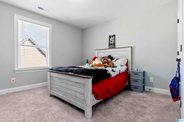 bedroom with light colored carpet