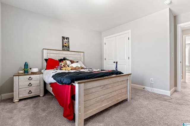 bedroom with carpet flooring and a closet