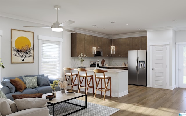 kitchen with a breakfast bar, light wood-type flooring, stainless steel appliances, and tasteful backsplash