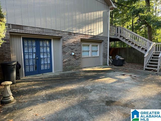 view of side of home featuring french doors