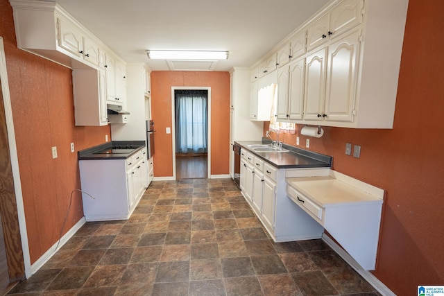 kitchen featuring white cabinetry, sink, and black appliances