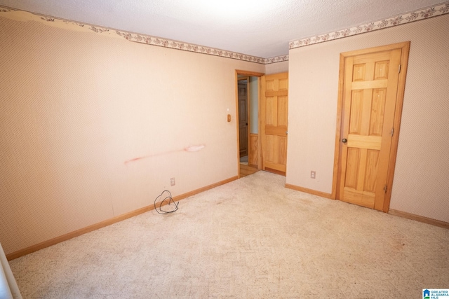 empty room with carpet flooring