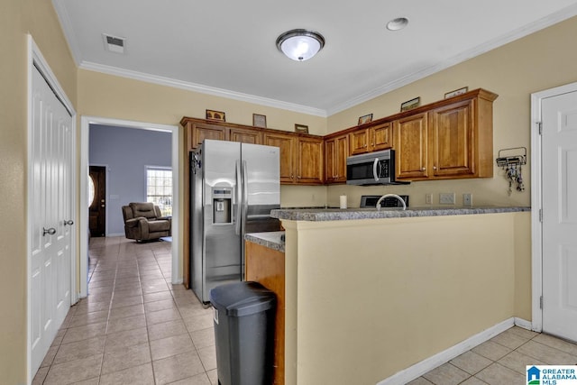 kitchen featuring stainless steel appliances, light stone counters, crown molding, and light tile patterned flooring