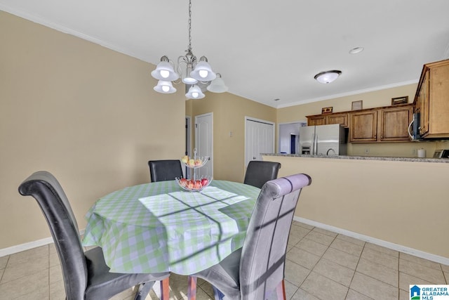 dining area with crown molding, light tile patterned floors, and a notable chandelier