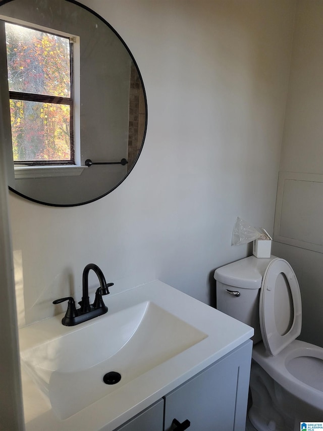 bathroom with vanity and toilet