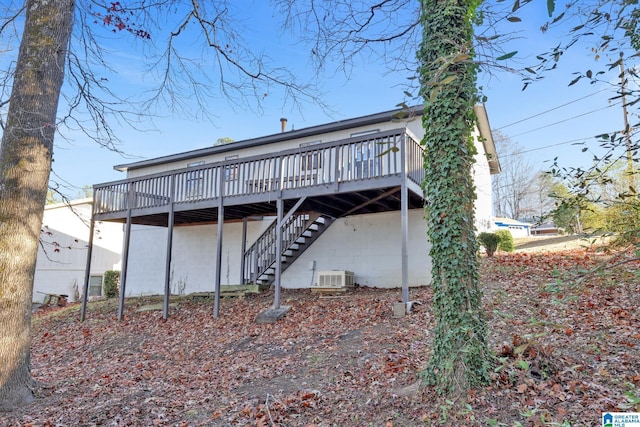 back of house featuring a wooden deck