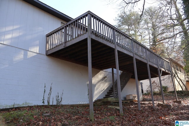 view of side of home featuring a wooden deck