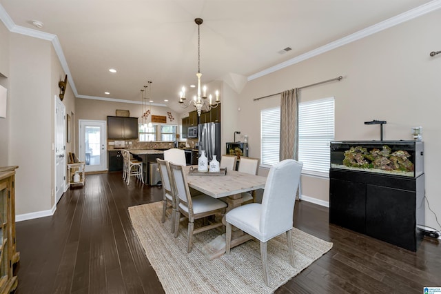 dining area featuring a notable chandelier, dark hardwood / wood-style floors, and ornamental molding