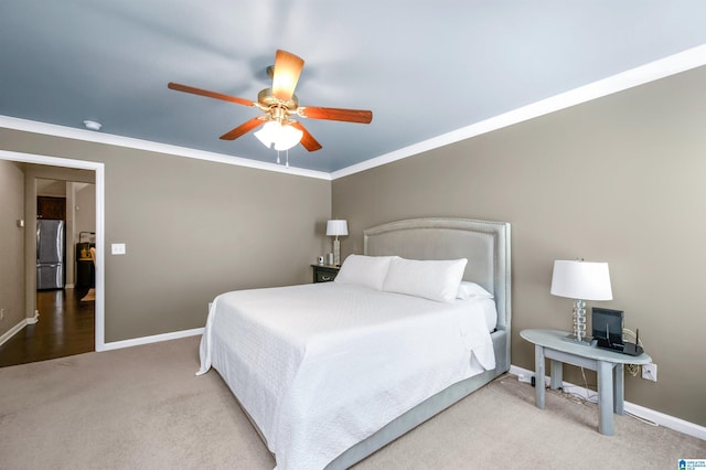 bedroom featuring carpet flooring, stainless steel fridge, ceiling fan, and crown molding