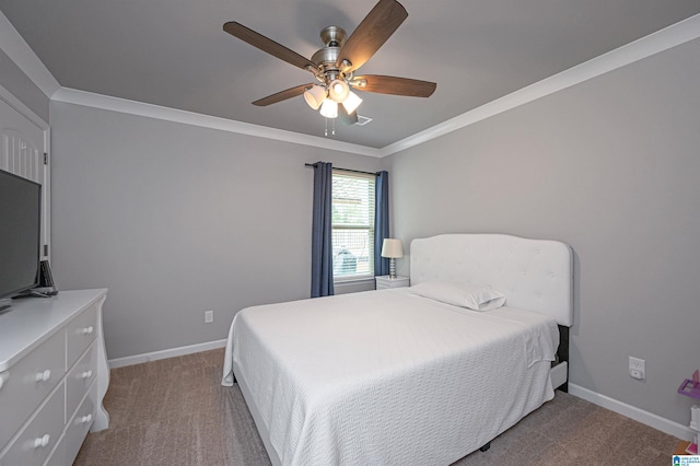 bedroom with ceiling fan, carpet floors, and ornamental molding