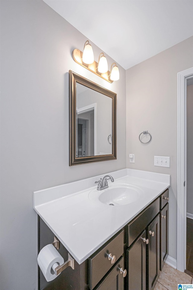 bathroom with tile patterned flooring and vanity