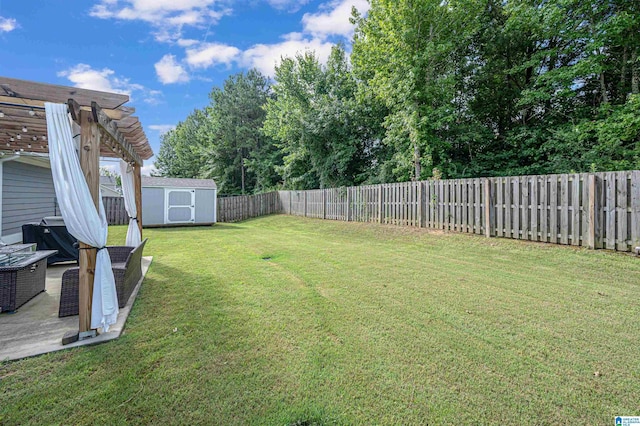 view of yard with a pergola and a storage unit