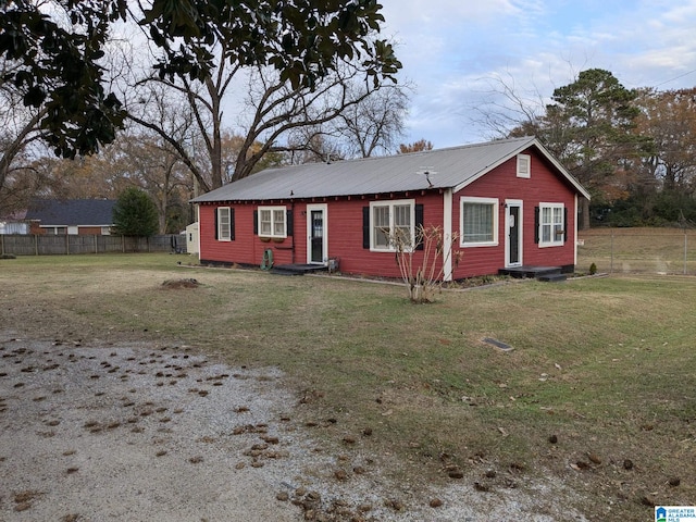 ranch-style home with a front lawn