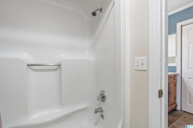 bathroom with tile patterned floors, vanity, and bathing tub / shower combination