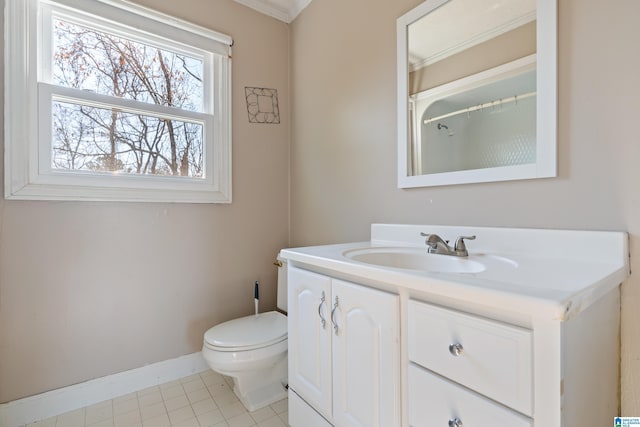 bathroom with tile patterned floors, crown molding, vanity, and toilet