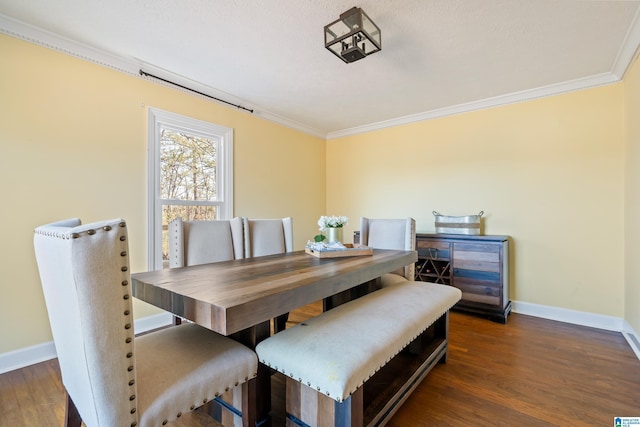 dining room with crown molding and dark wood-type flooring