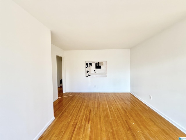 unfurnished room featuring wood-type flooring