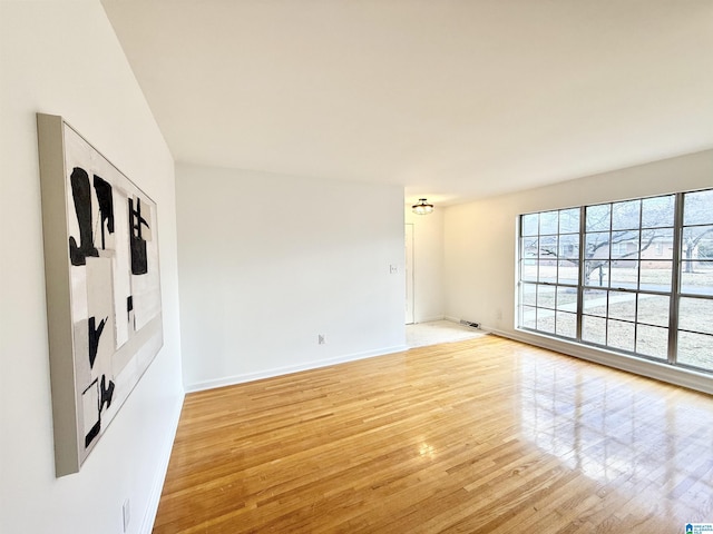 spare room with light hardwood / wood-style floors