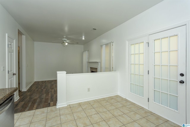 spare room featuring ceiling fan and light hardwood / wood-style floors