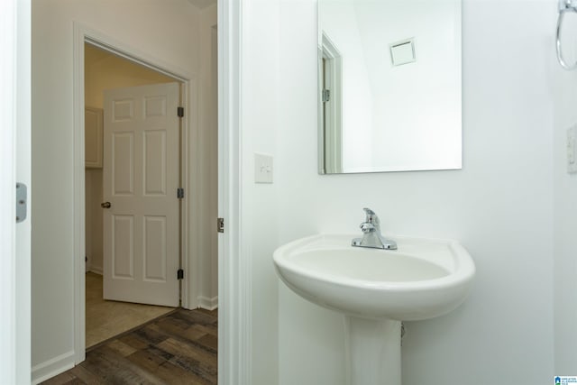 bathroom with wood-type flooring