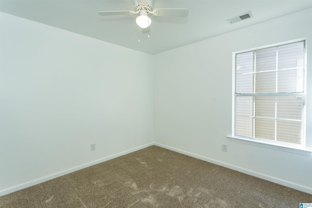 empty room featuring carpet flooring and ceiling fan