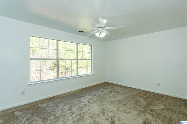 carpeted empty room with ceiling fan