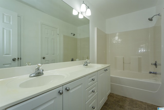 bathroom with vanity and shower / washtub combination