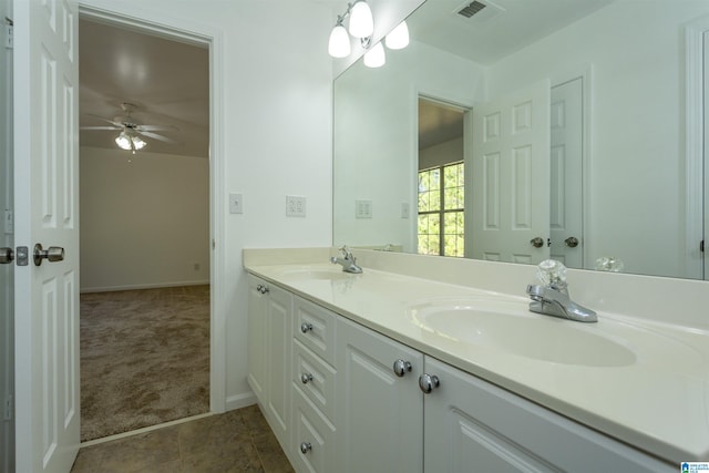 bathroom featuring tile patterned flooring, vanity, and ceiling fan