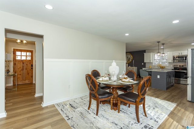 dining room with light hardwood / wood-style floors