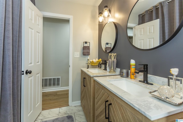 bathroom featuring hardwood / wood-style floors and vanity