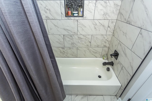 bathroom with shower / bathtub combination with curtain