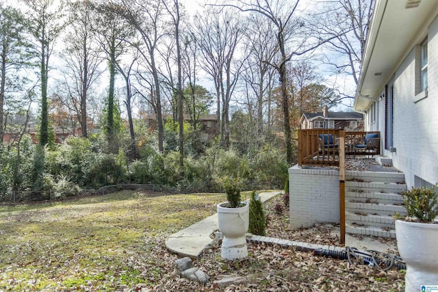 view of yard with a wooden deck