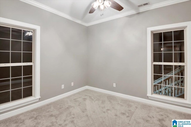 unfurnished room featuring carpet floors, ceiling fan, and ornamental molding