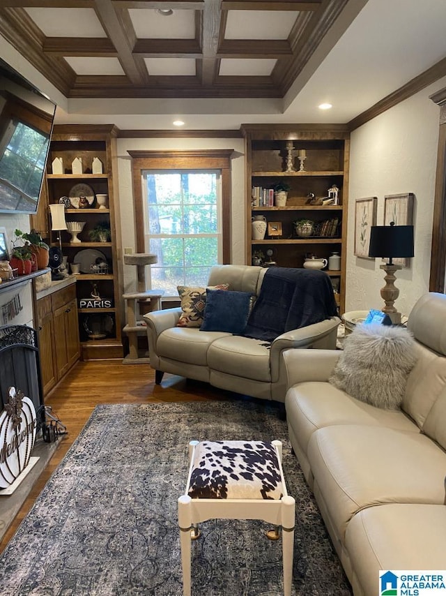 living room featuring beam ceiling, light hardwood / wood-style flooring, coffered ceiling, and ornamental molding