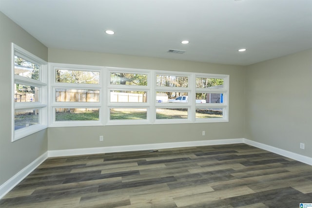 unfurnished room featuring dark hardwood / wood-style floors