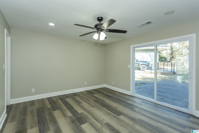 unfurnished room with ceiling fan and dark wood-type flooring